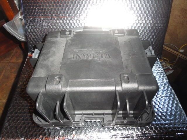 Invicta watch carrying case in black with grey handles holds 3 watches