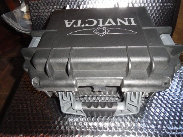 Invicta watch carrying case in black with grey handles holds 3 watches