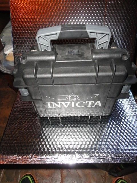 Invicta watch carrying case in black with grey handles holds 3 watches