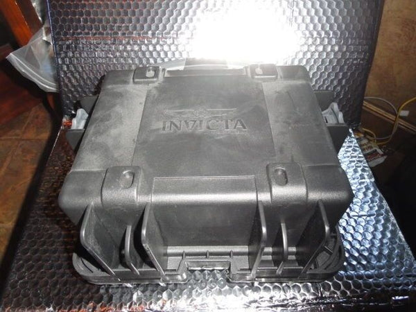 Invicta watch carrying case in black with grey handles holds 3 watches